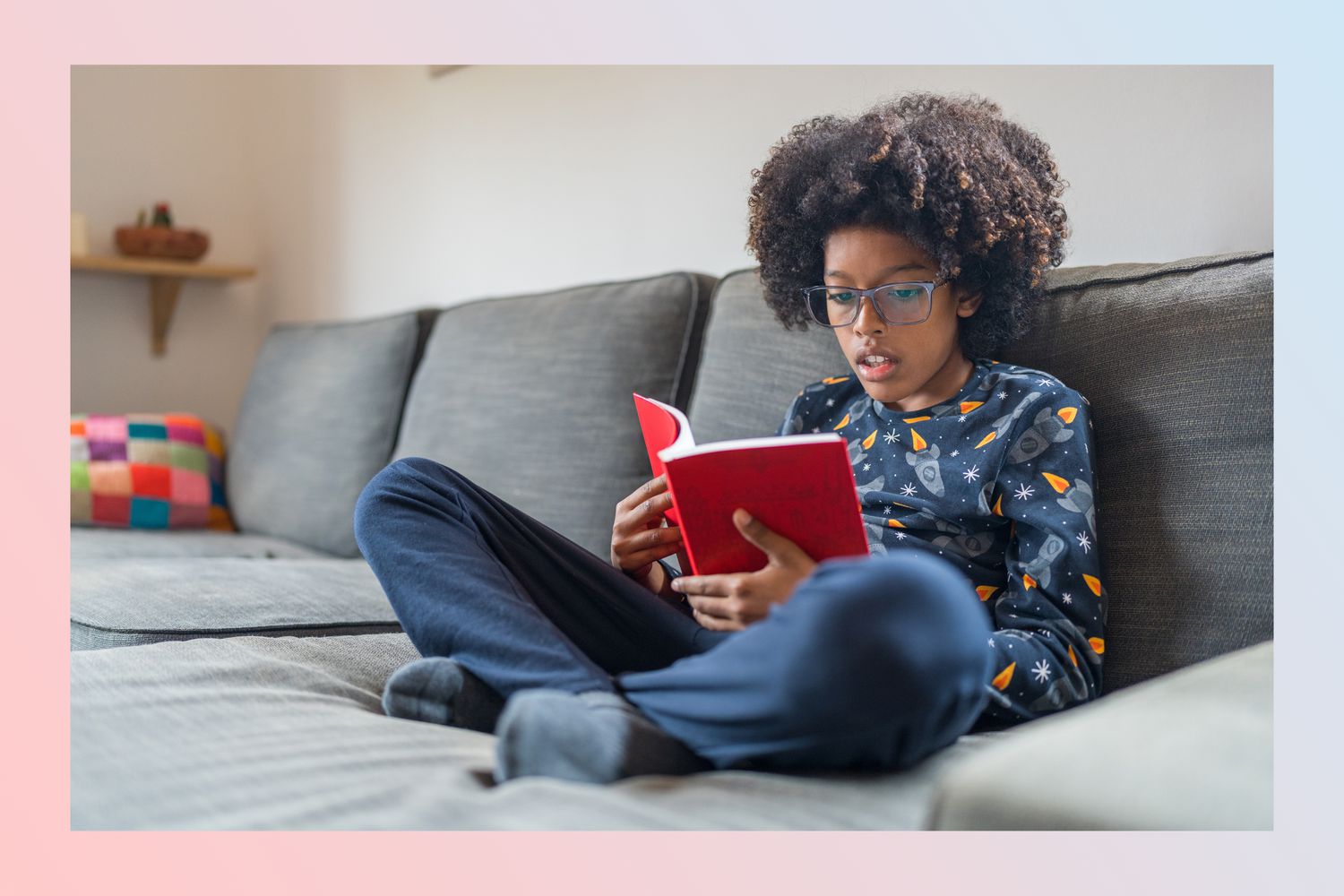 handsome brown child reading a book